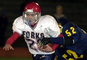 The Devils' Drew Batty breaks away from Oneonta's Liam Murray and scampers away to a 72-yard touchdown run in the second quarter at Union-Endicott's Ty Cobb Stadium. Forks won, 25-14, to improve to 10-0 and advance to the Class B state tournament quarterfinals in the Carrier Dome against Cazenovia of Section 3