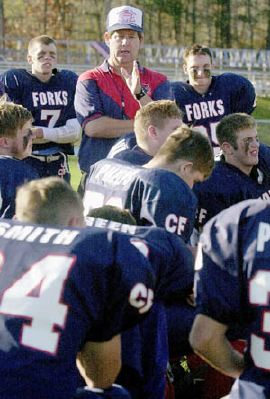 The preachings of coach Kelsey Green, center, have been followed to the fullest by the Chenango Forks football team this season. The Blue Devils, relying on a run-dominated offense and a stingy, opportunistic defense, have gone 12-0 and moved to within one victory of a state Class B championship. 